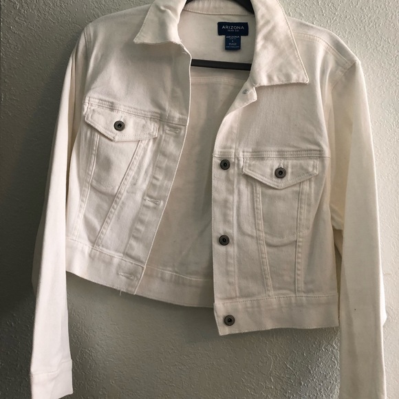White jean jacket has tiny bit of coloring on it shown in photo size small - Picture 1 of 3